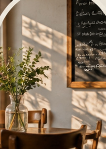 Sunlit café seating with flowers